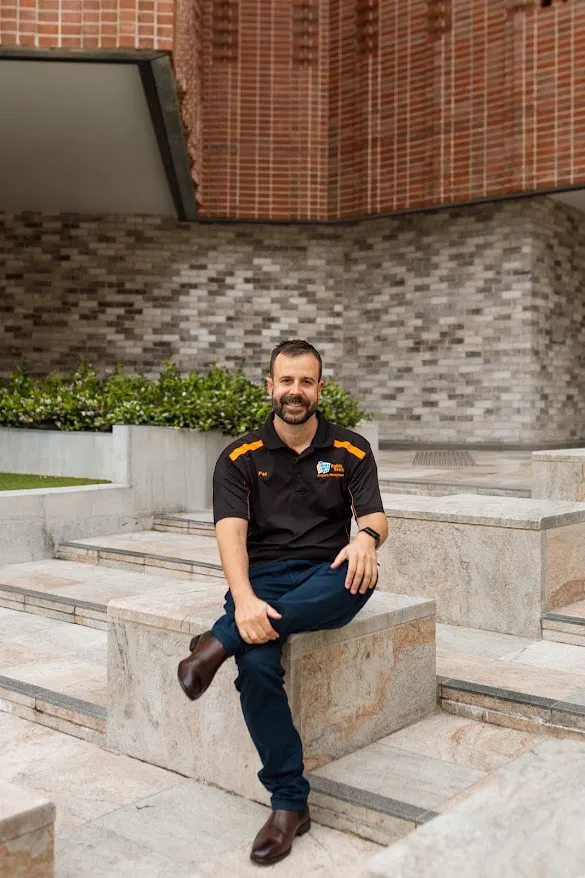 Pat Mears sitting on stone steps in Maitland
